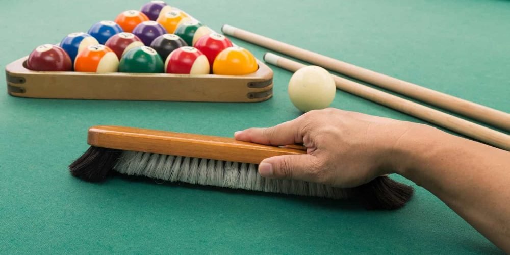 up-hand-brushing-snooker-pool-billards-table-with-bal-2021-08-30-18-49-45-utc.jpg